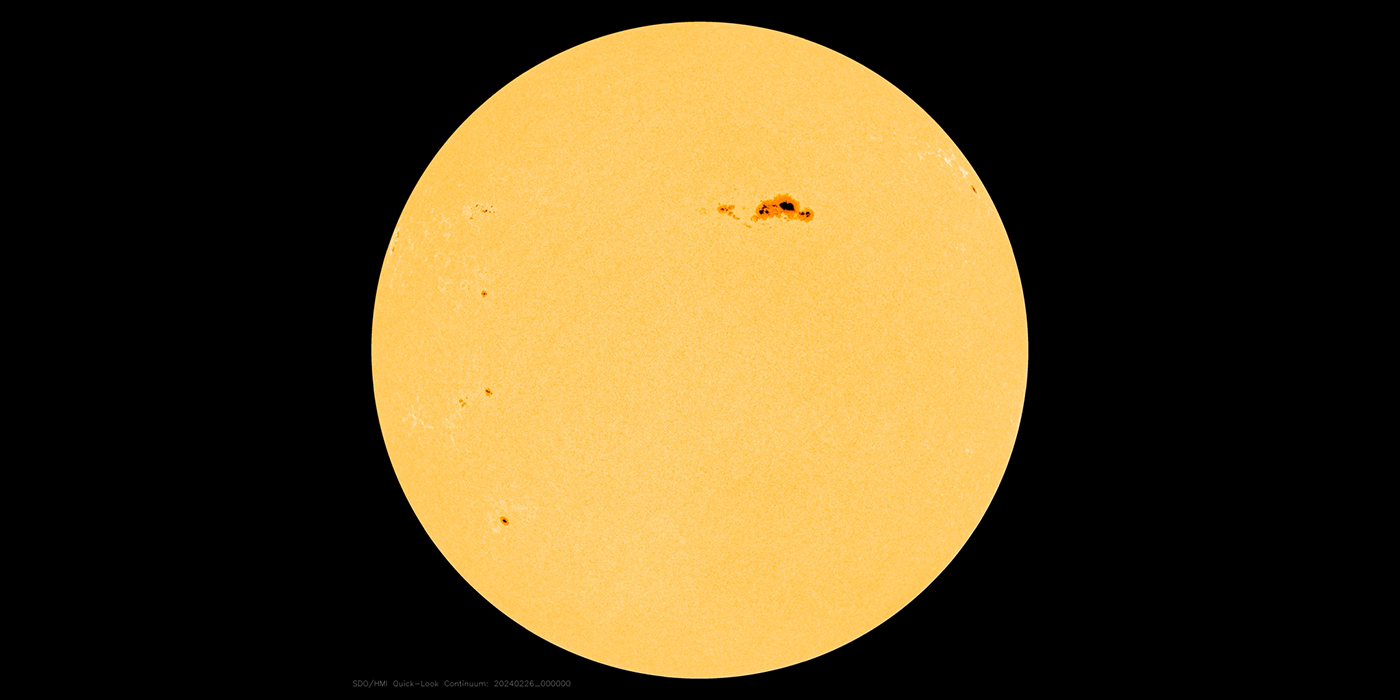 the Sun with a dark spot on upper right