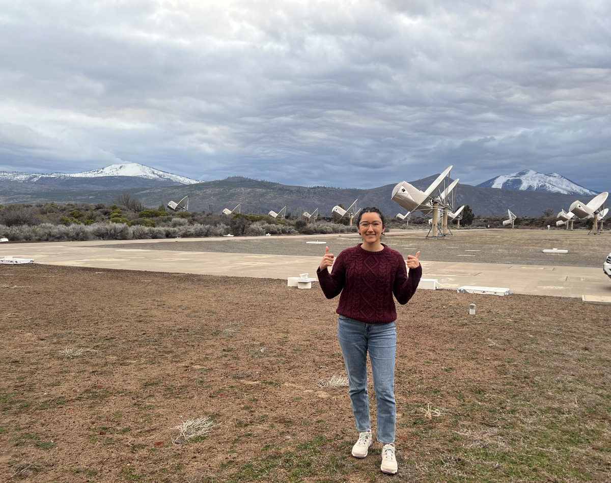 Karen Perez posing in front of the Allen Telescope Array