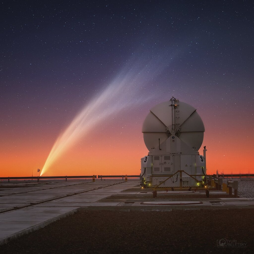 ATLAS under a orange and purple sunset under a blanket of bright stars