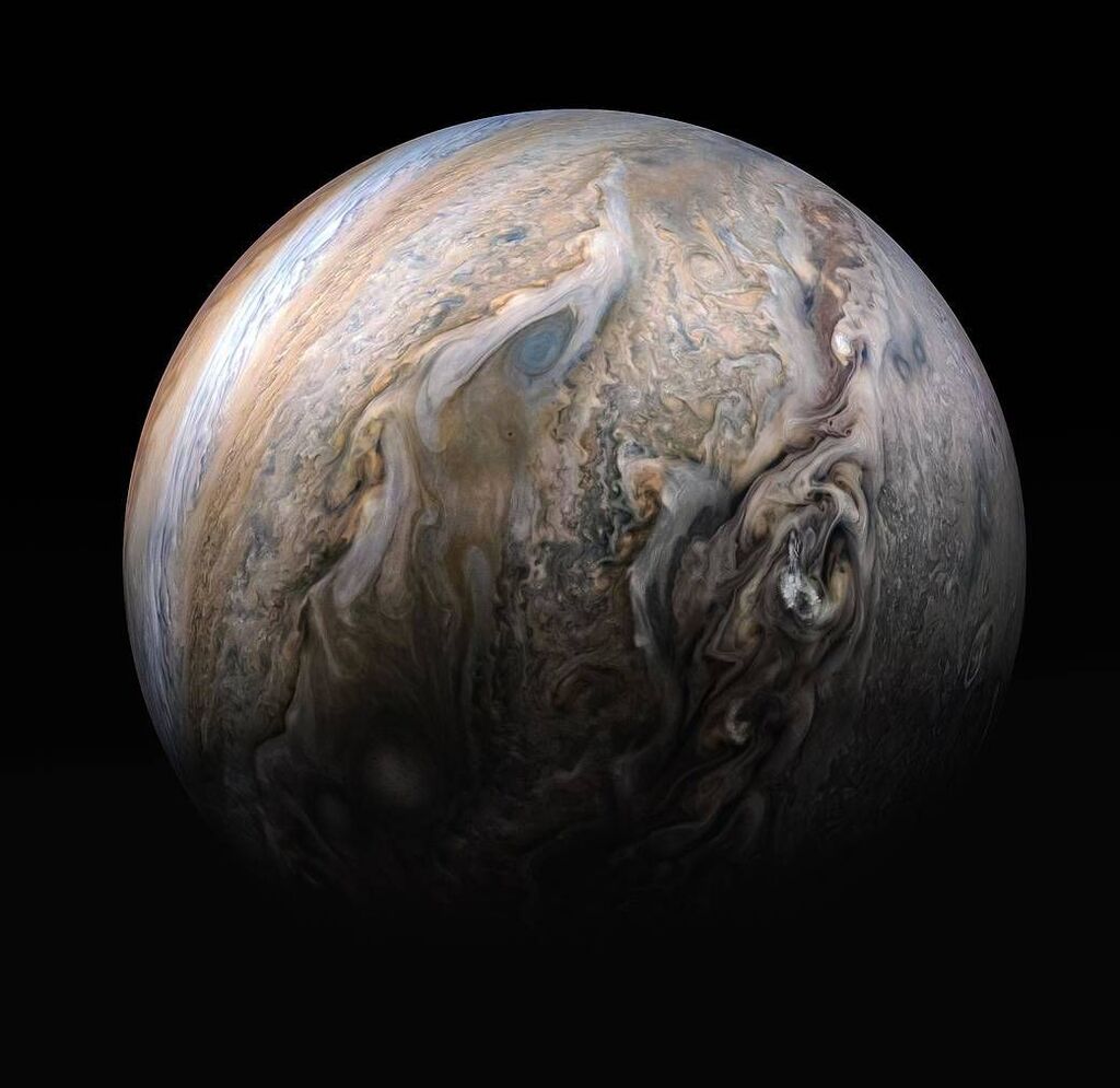 close up views of the beautiful beiges and blue swirls surrounding the planet