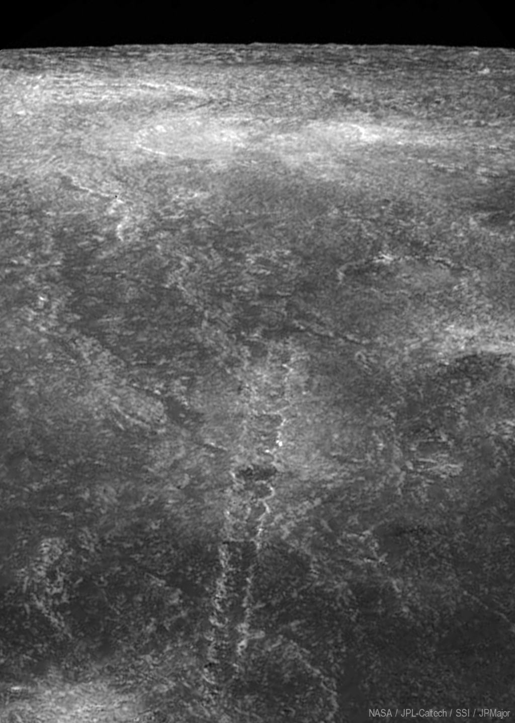 black and white image of the moon covered in craters