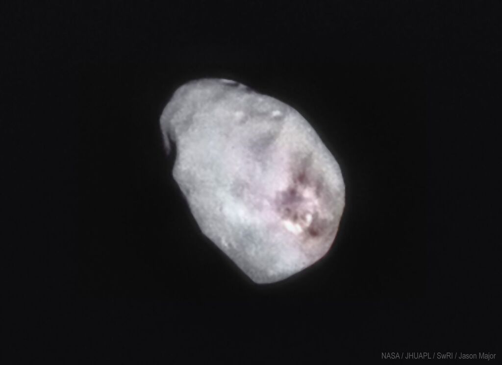 blurry image of Nix against a black background