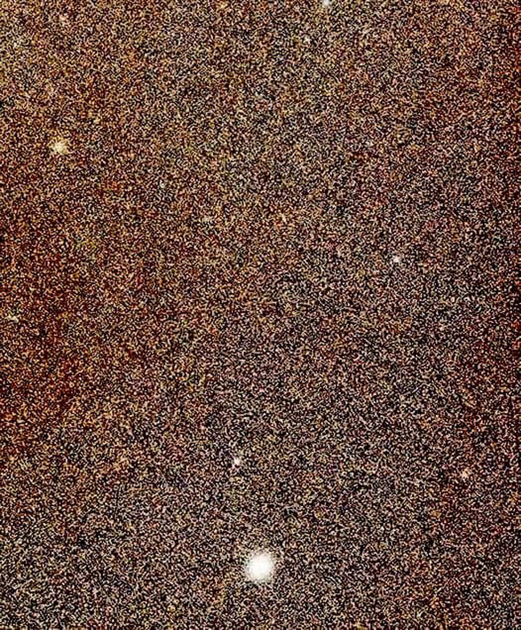 grainy photo of a few dots showing the Andromeda Galaxy