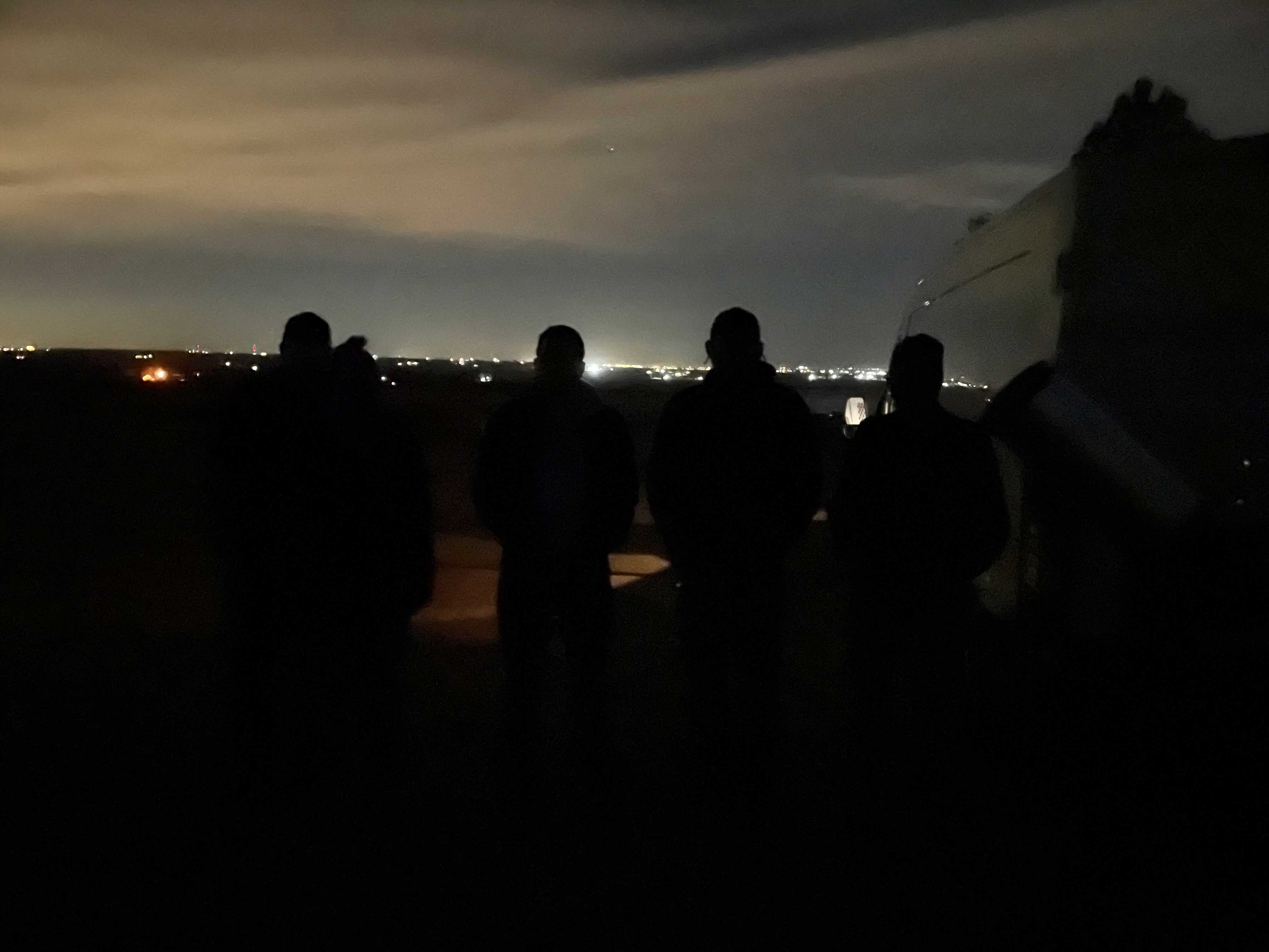 silhouettes of amateur astronomers