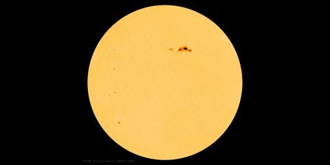 the Sun with a dark spot on upper right