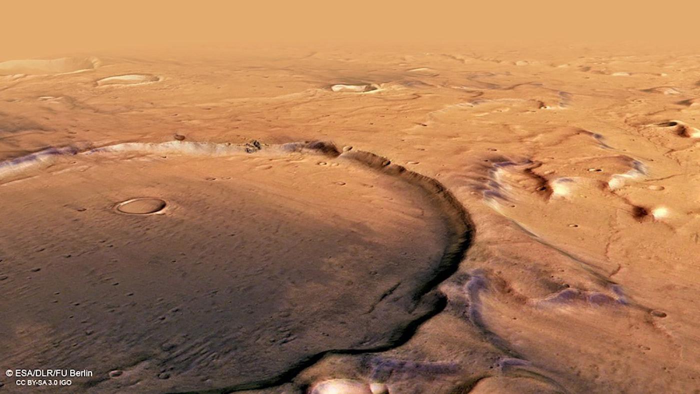 A small impact crater sits inside larger crater in Terra Cimmeria.
