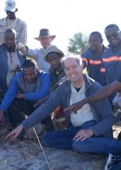 Search team pointing to the first meteorite found