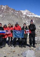 Dale Andersen and team with SETI Institute expedition flag